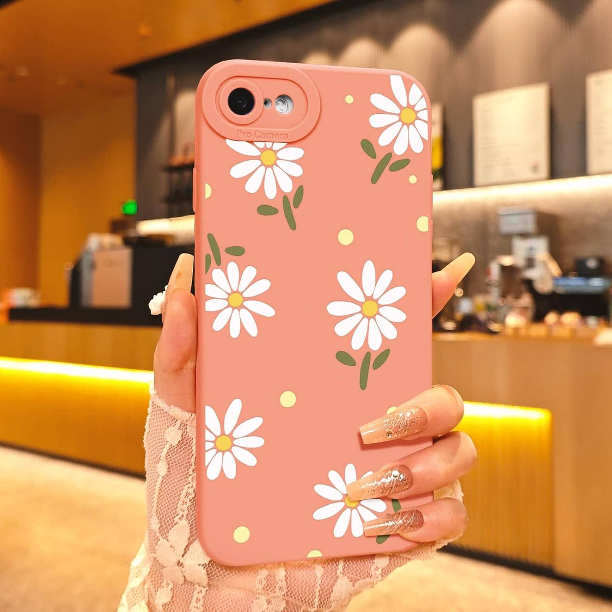 Pink iPhone SE/8/7 case with daisy flower print and camera cutout