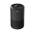 Black cylindrical air purifier with top fan grille and perforated front intake
