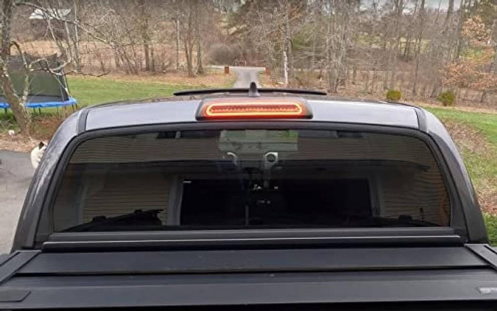 High mount third brake light with red LED glow above rear window