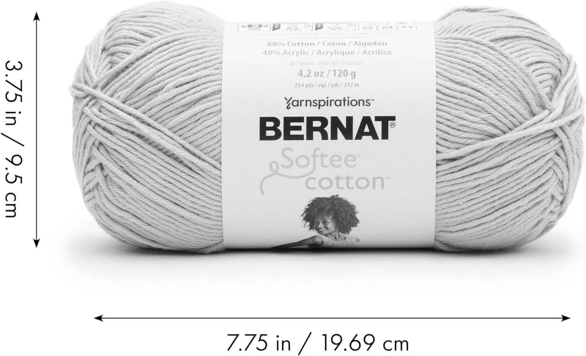 Two white yarn skeins with Bernat Softee Cotton label