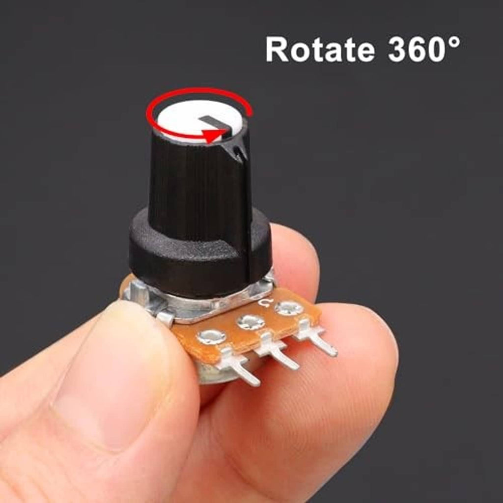 Rotary potentiometer close-up with black knob and metal shaft held between fingers