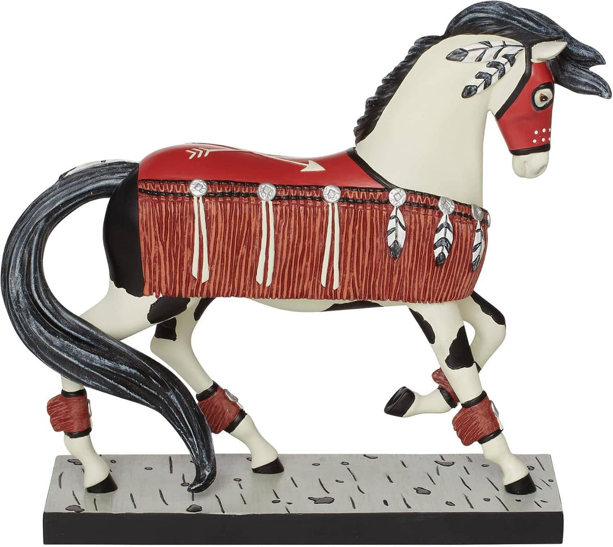 Painted horse figurine three-quarter view, red saddle blanket with beaded fringe, on speckled base