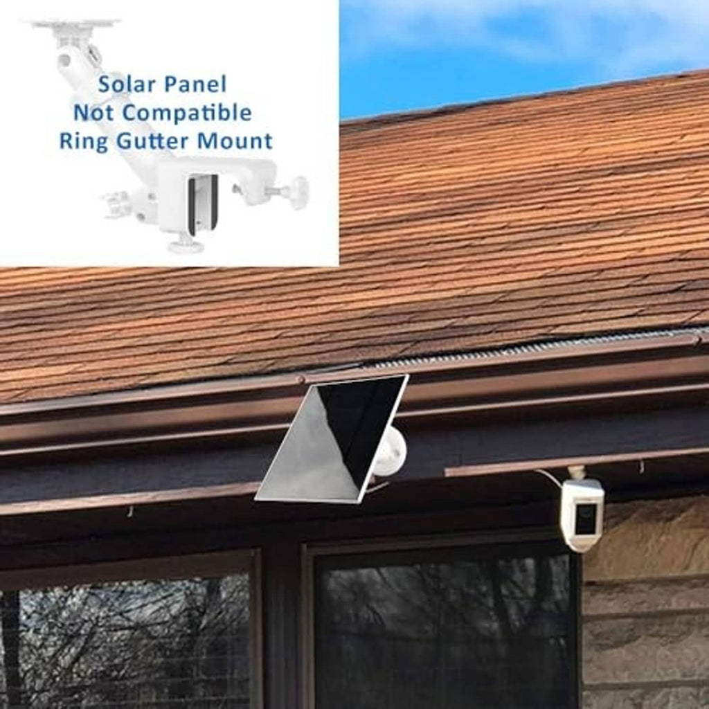 Outdoor solar panel charger mounted under eaves with cable routed to camera