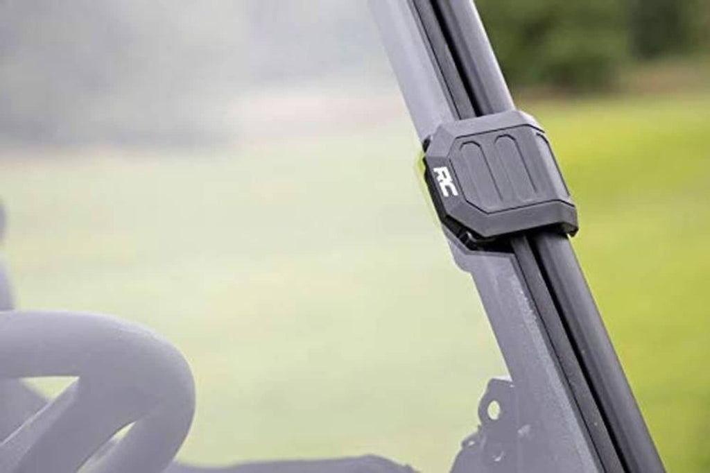 Close-up of windshield frame bracket and mounting tab