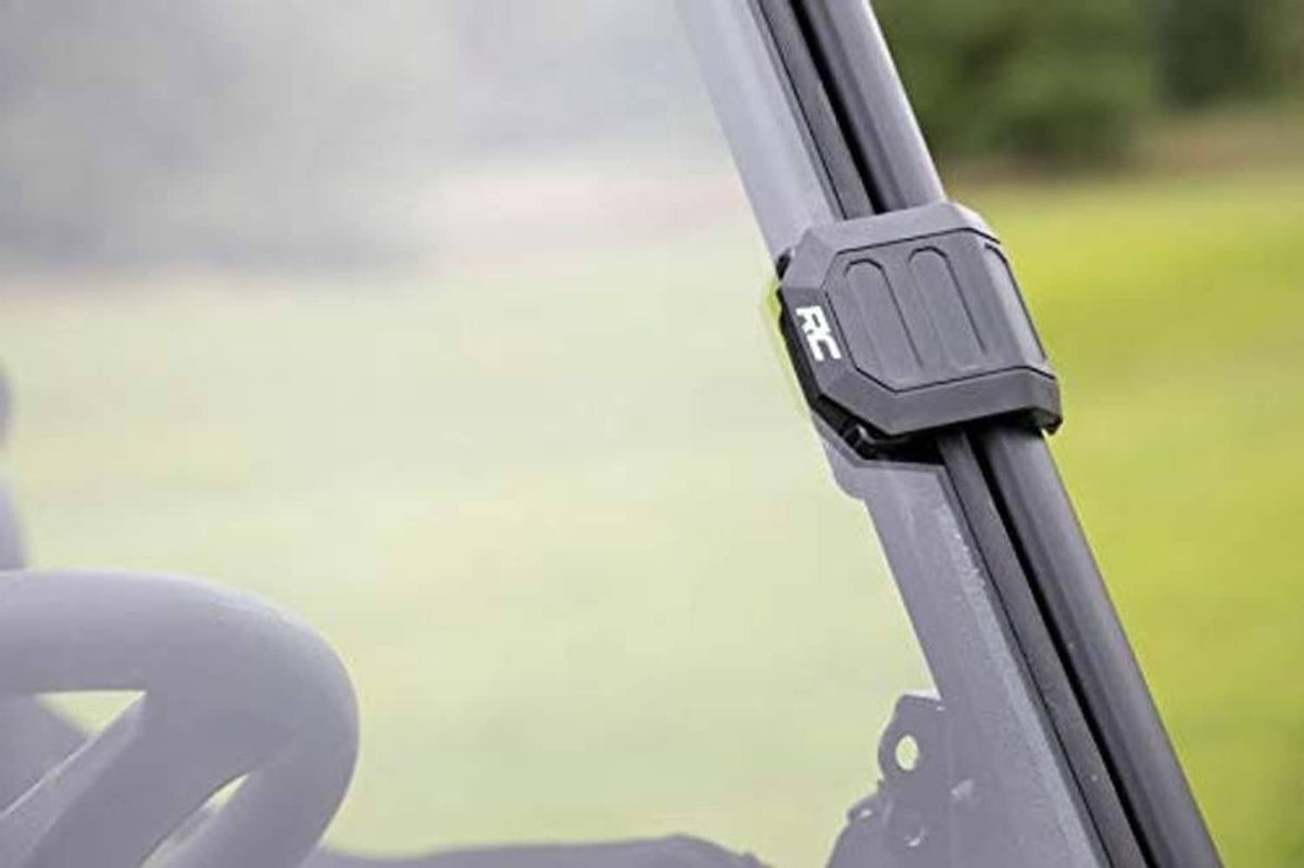 Close-up of windshield frame bracket and mounting tab