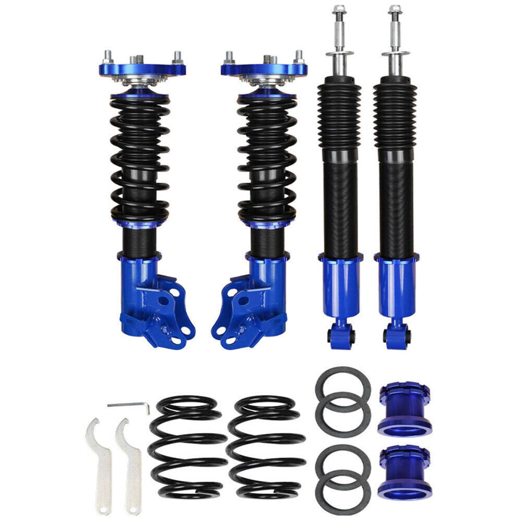 Pair of blue-and-black coilover struts with springs, bump stops, and mounting parts