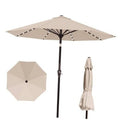 Beige 10 ft outdoor patio umbrella with solar LED light string and open canopy