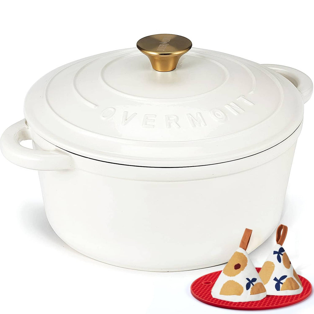 Pearl white enameled cast iron Dutch oven with gold-tone knob and lid handles