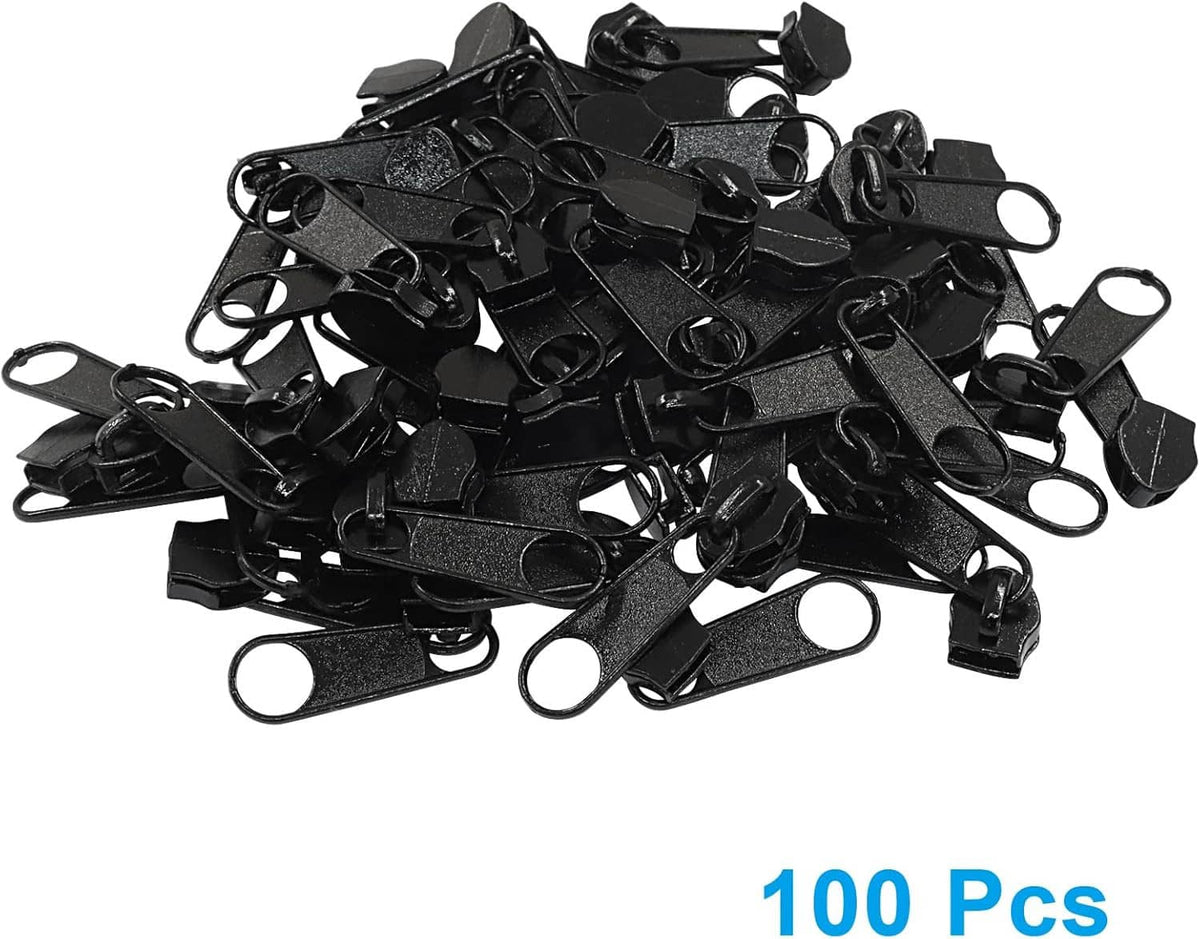 Black zipper sliders bulk pack, assorted pulls and loop rings piled together
