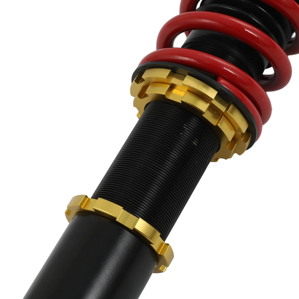 Coilover suspension strut with red spring, black threaded body, and gold adjustment collars