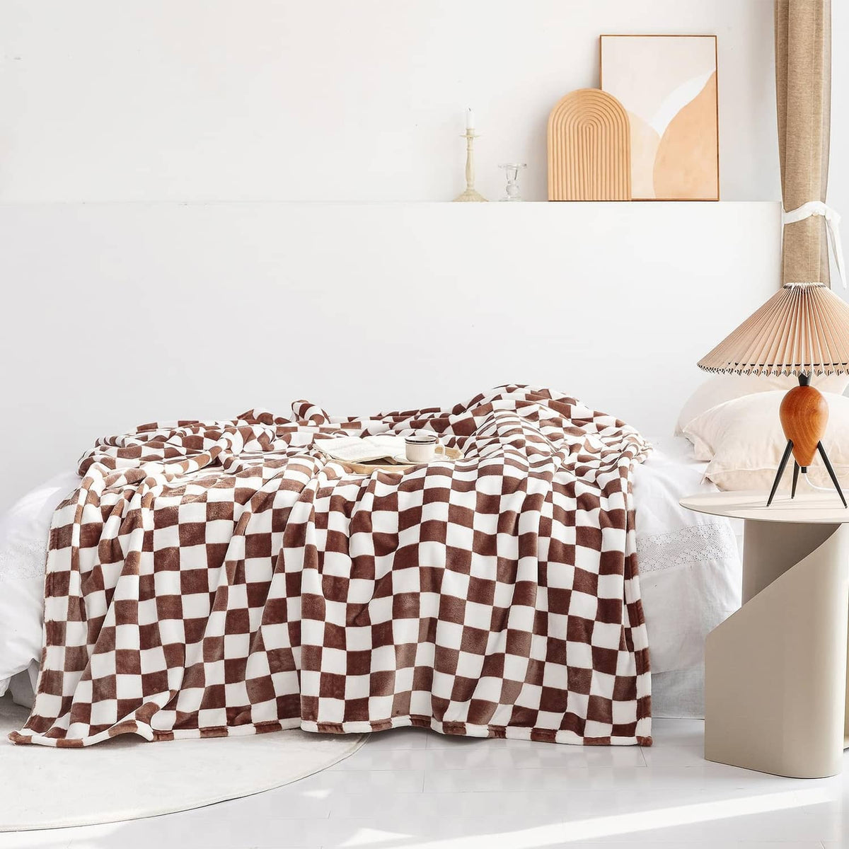 Checkerboard flannel throw blanket with coffee-brown and white checks on bed