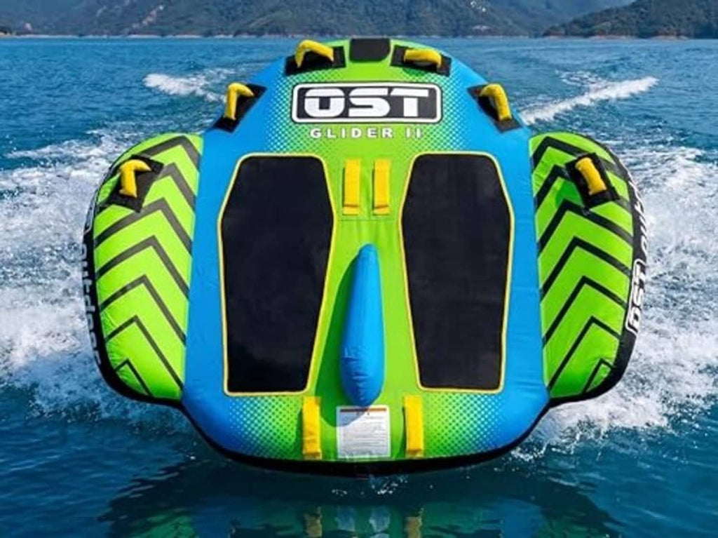 Deck-style towable boat tube with blue-green graphics, center fin, and side handles