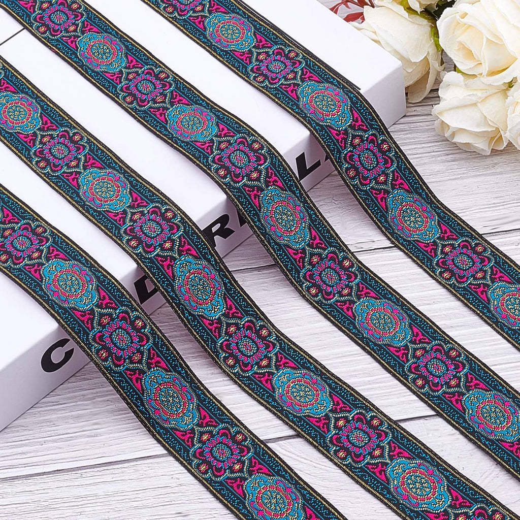 Embroidered jacquard ribbon strips with teal and magenta floral border on dark tape
