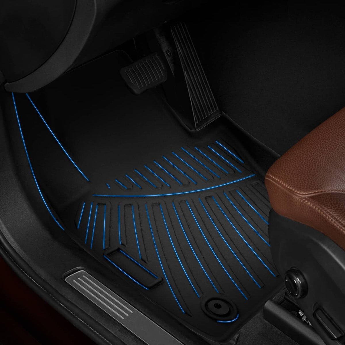 Black TPE floor mat with raised ridges and circular anchor holes in a vehicle footwell