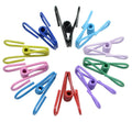 Assorted PVC-coated chip clips in multiple colors, spread out on a plain background
