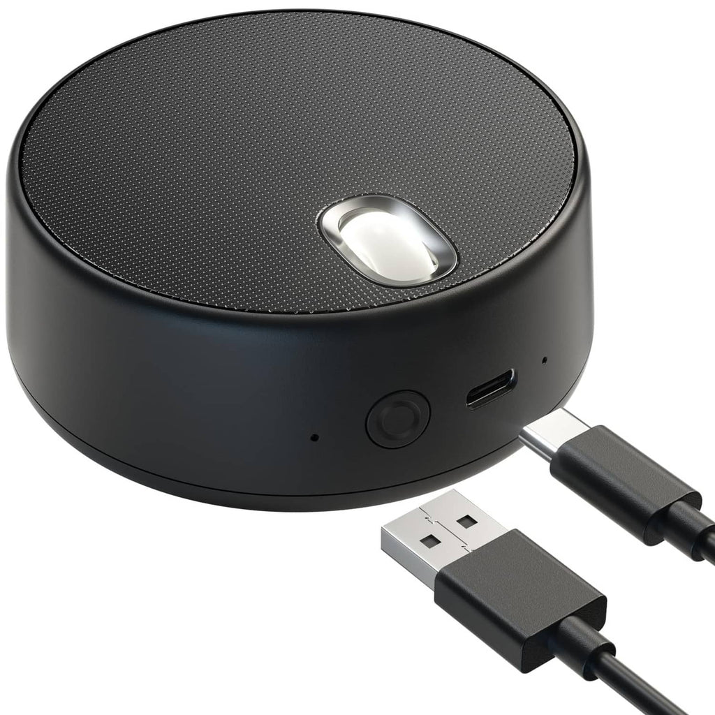 Round black USB computer speaker with built-in microphone, USB cable connected