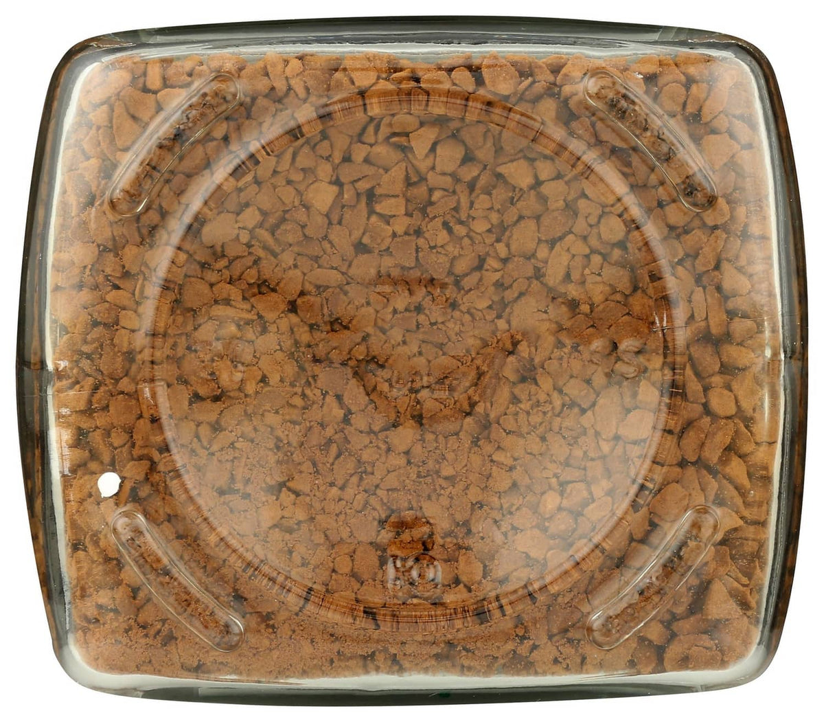 Top view of instant coffee jar showing dark roast beans through clear glass