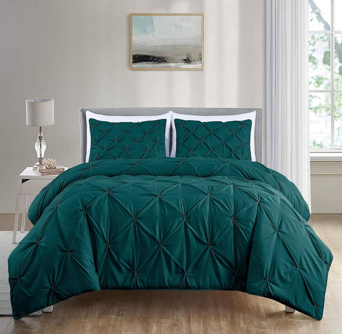 Teal diamond tufted king comforter with two square pillows on a white bed
