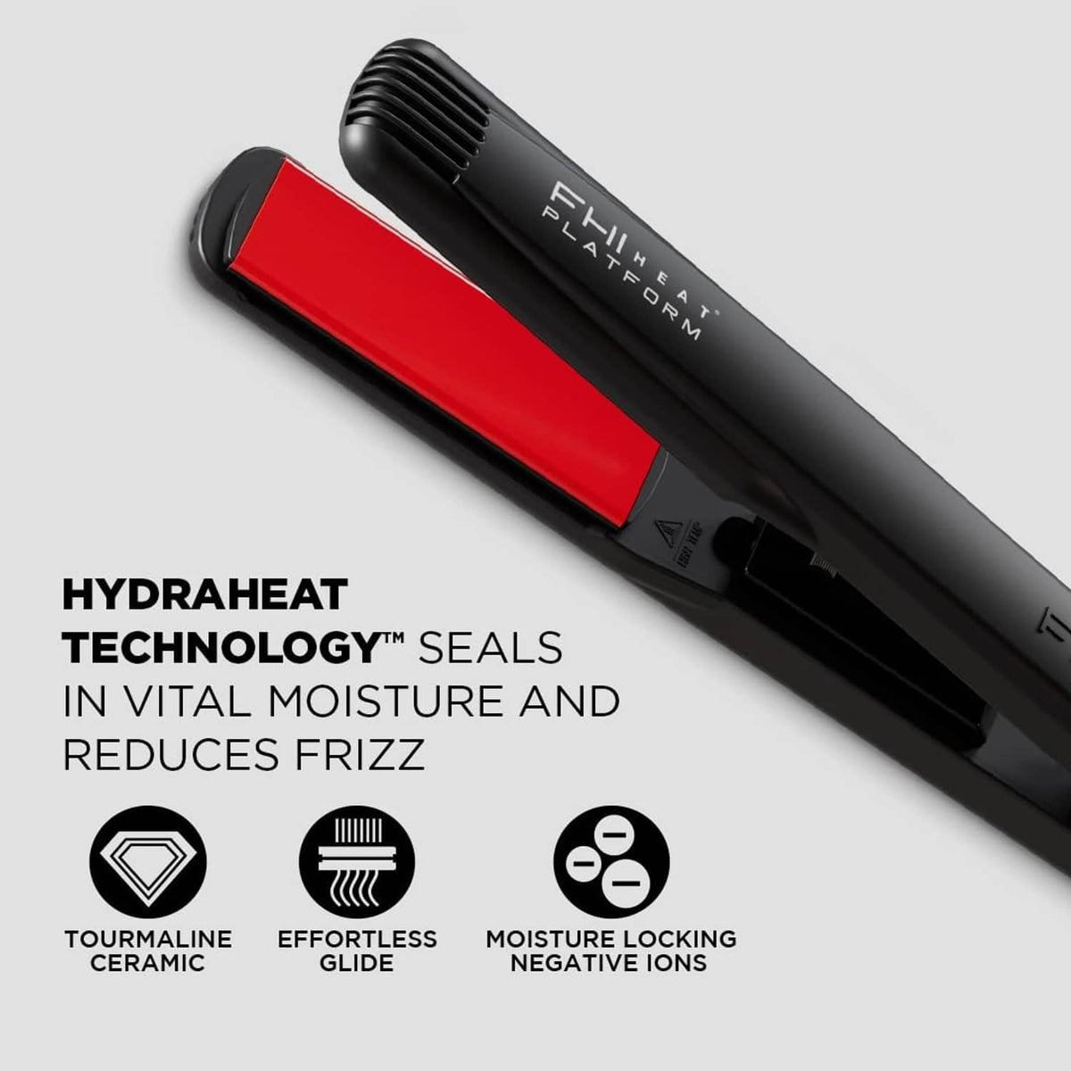 Black hair straightener with red plates and control panel, with Hydraheat-style vented top