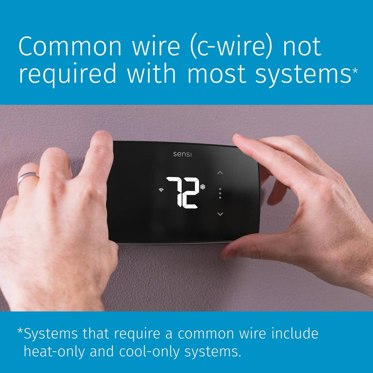 Black Sensi Lite smart thermostat mounted on wall with hands adjusting it