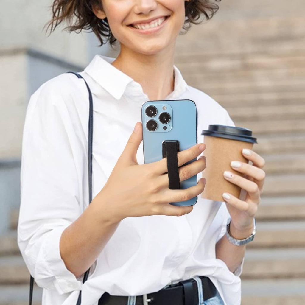 Phone strap finger holder attached to a blue phone case, held in one hand