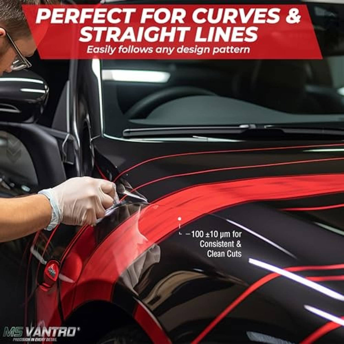 Knifeless tape being used to trace straight and curved lines on a car panel.