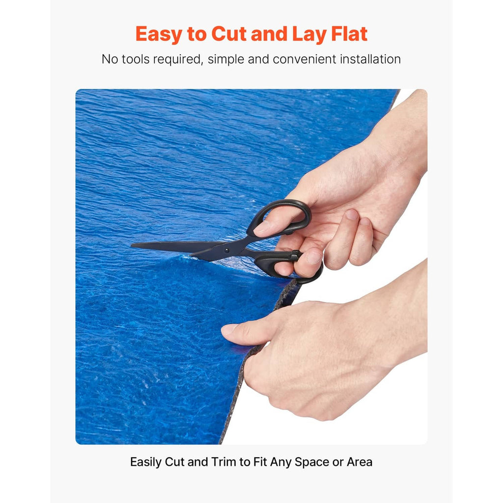Blue floor underlayment sheet being trimmed with a utility knife, dark backing visible