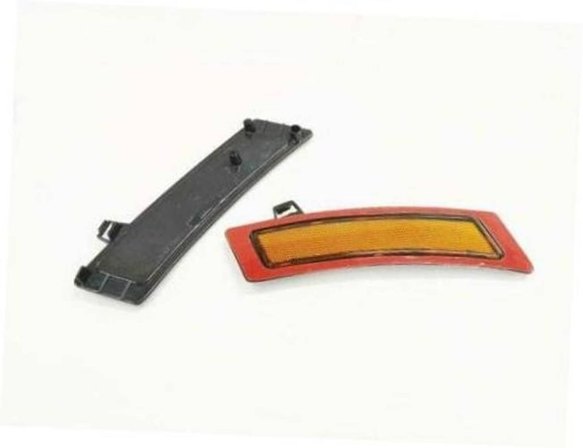 Amber side marker reflector with red trim and black mounting bracket