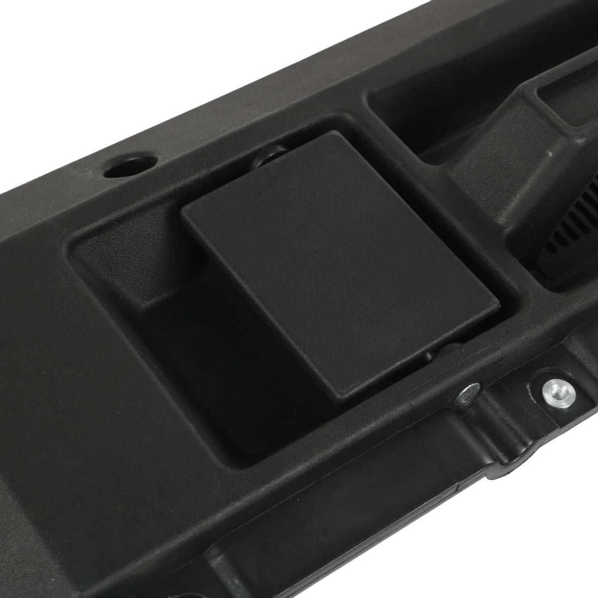 Black interior door handle cover with recessed thumb pad and metal attachment points