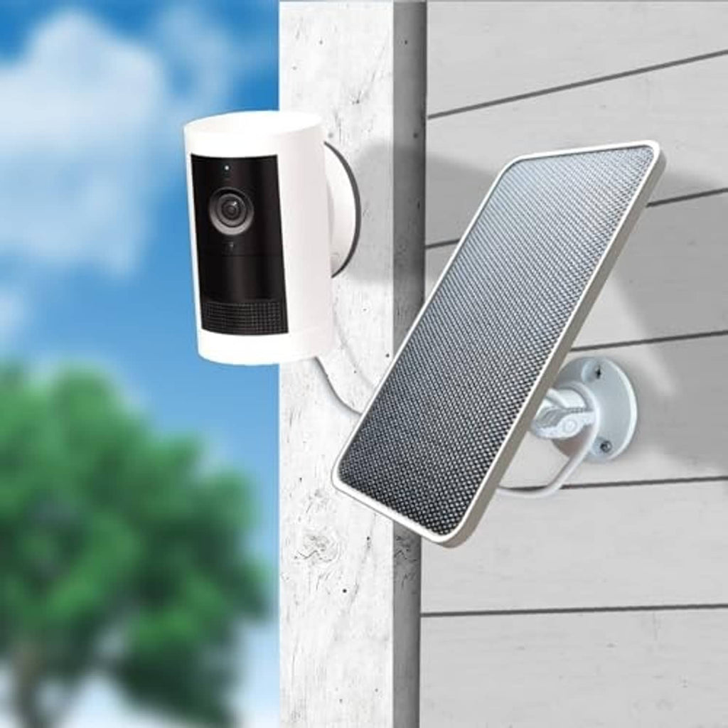 Outdoor solar panel charger mounted on a wall next to a security camera