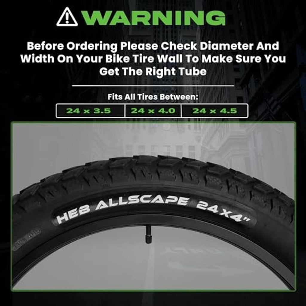 Black bike inner tube with valve stem beside tire tread