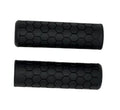 Black hexagon-pattern bike handlebar grips, textured non-slip rubber, pair view