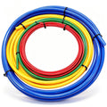 Coiled multicolor PE pipe extension tubes: red/green/yellow inside blue outer hose