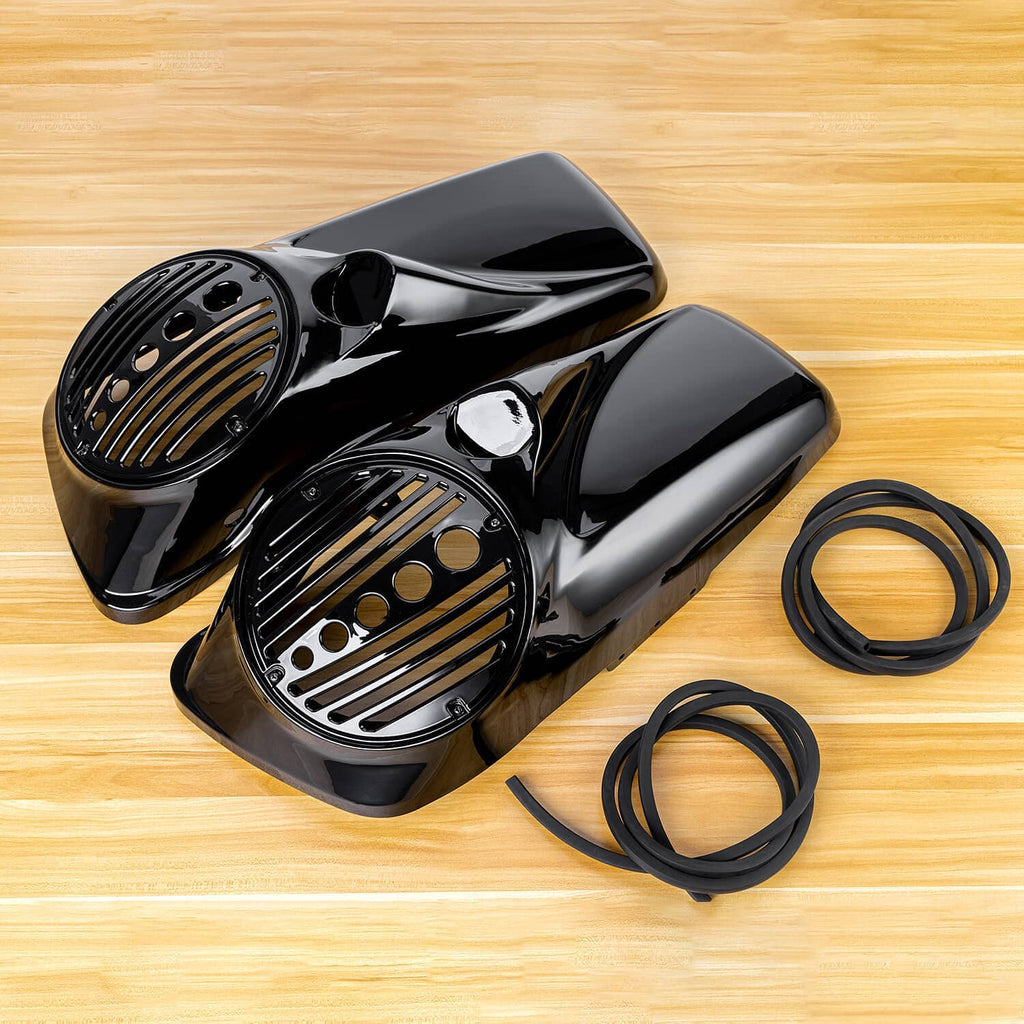 Black glossy speaker lids pair with metal grille inserts and black rubber trim rings