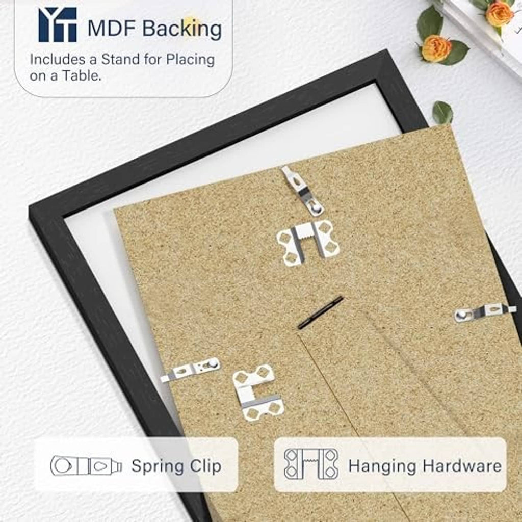 Black picture frame back with corkboard insert and metal clips for hanging or display