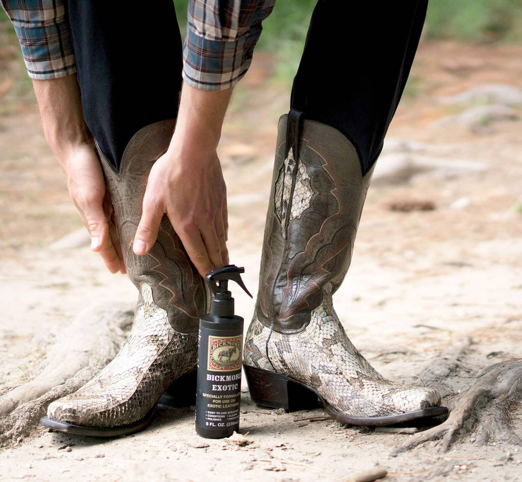 Leather spray cleaner bottle with hands cleaning patterned cowboy boots