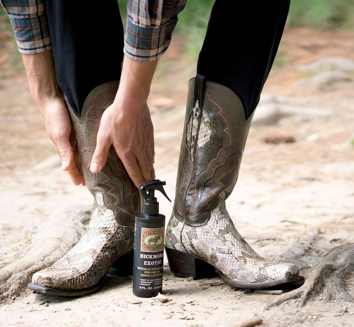 Leather spray cleaner bottle with hands cleaning patterned cowboy boots