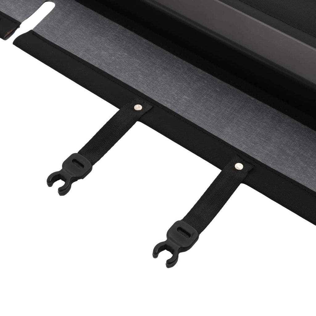 Close-up of black cargo cover straps and mounting clips on the long base bar