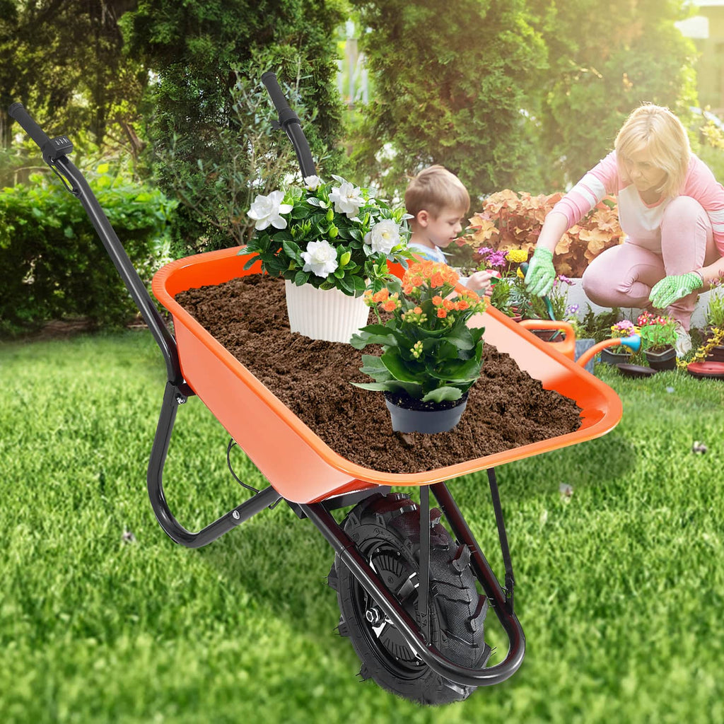 Orange electric one-wheel wheelbarrow cart loaded with potted plants on grass