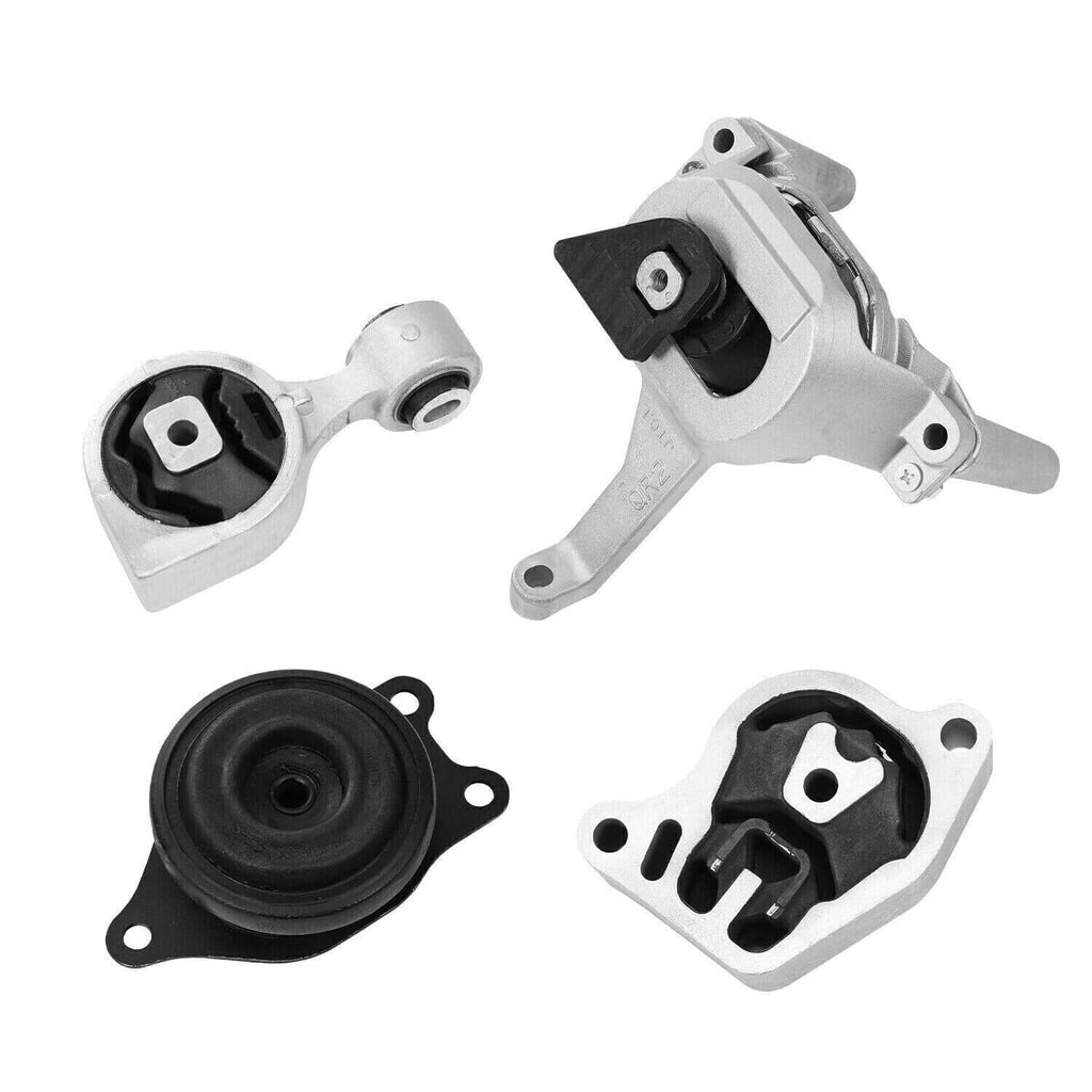 Engine mount kit components showing four mounts with black rubber insulators