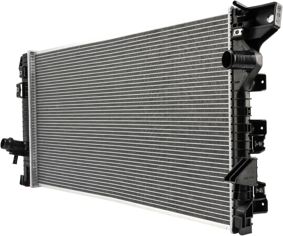 Vehicle radiator with silver aluminum cooling fins and black plastic end tanks, hose fittings