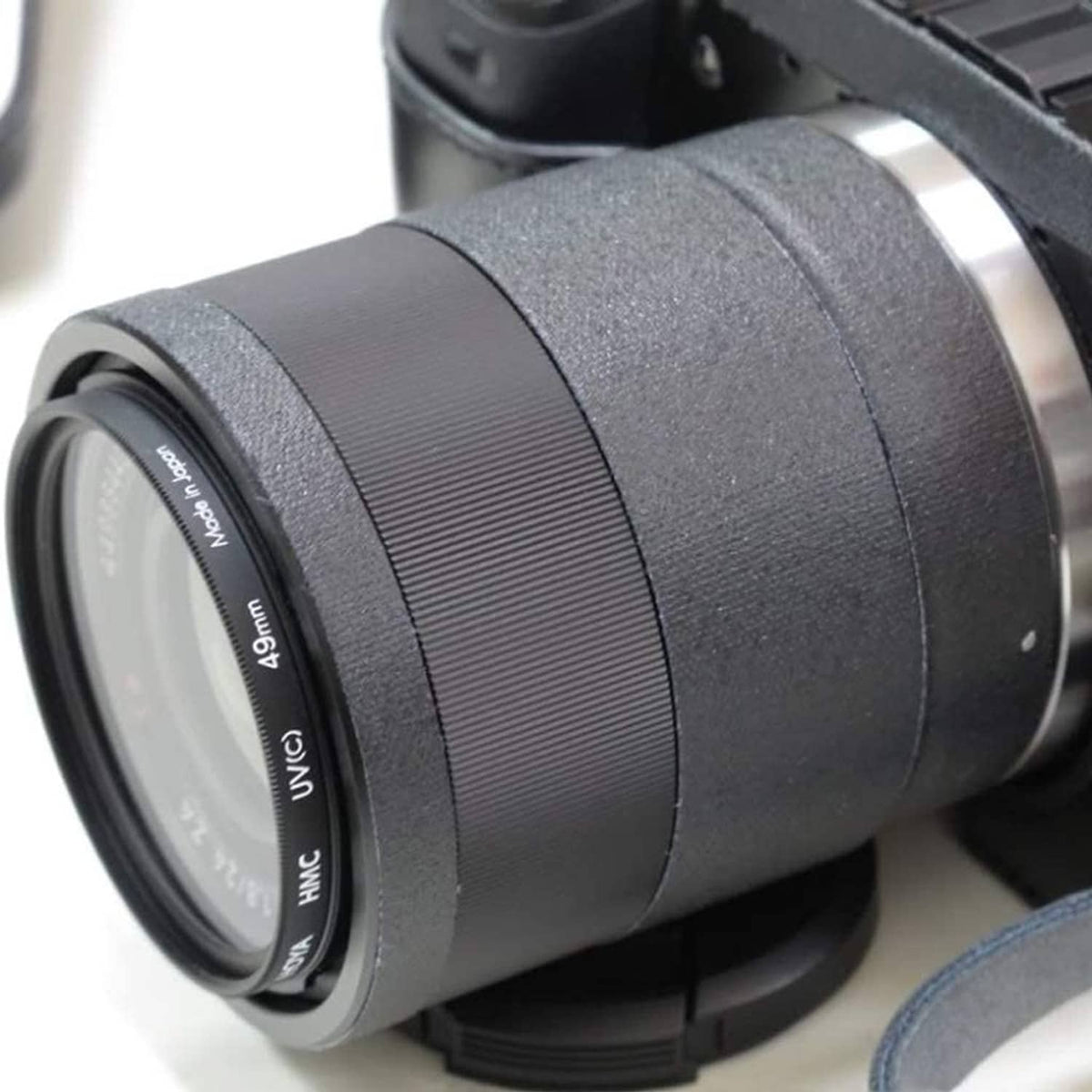 Close-up of gray gaffer tape roll showing ridged texture and inner label ring