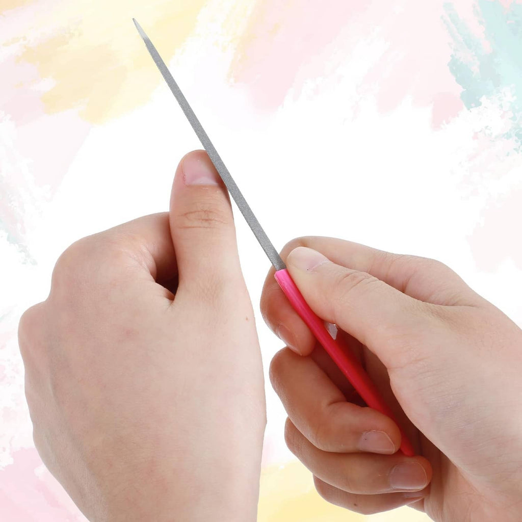 Metal diamond nail file with gray abrasive strip and pink handle, held between fingers.