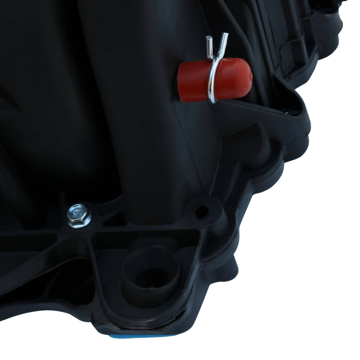 Black intake manifold corner with red vacuum cap and mounting bolt