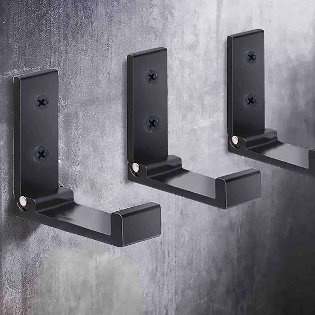 Three black folding wall hooks with U-shaped arms for hanging items