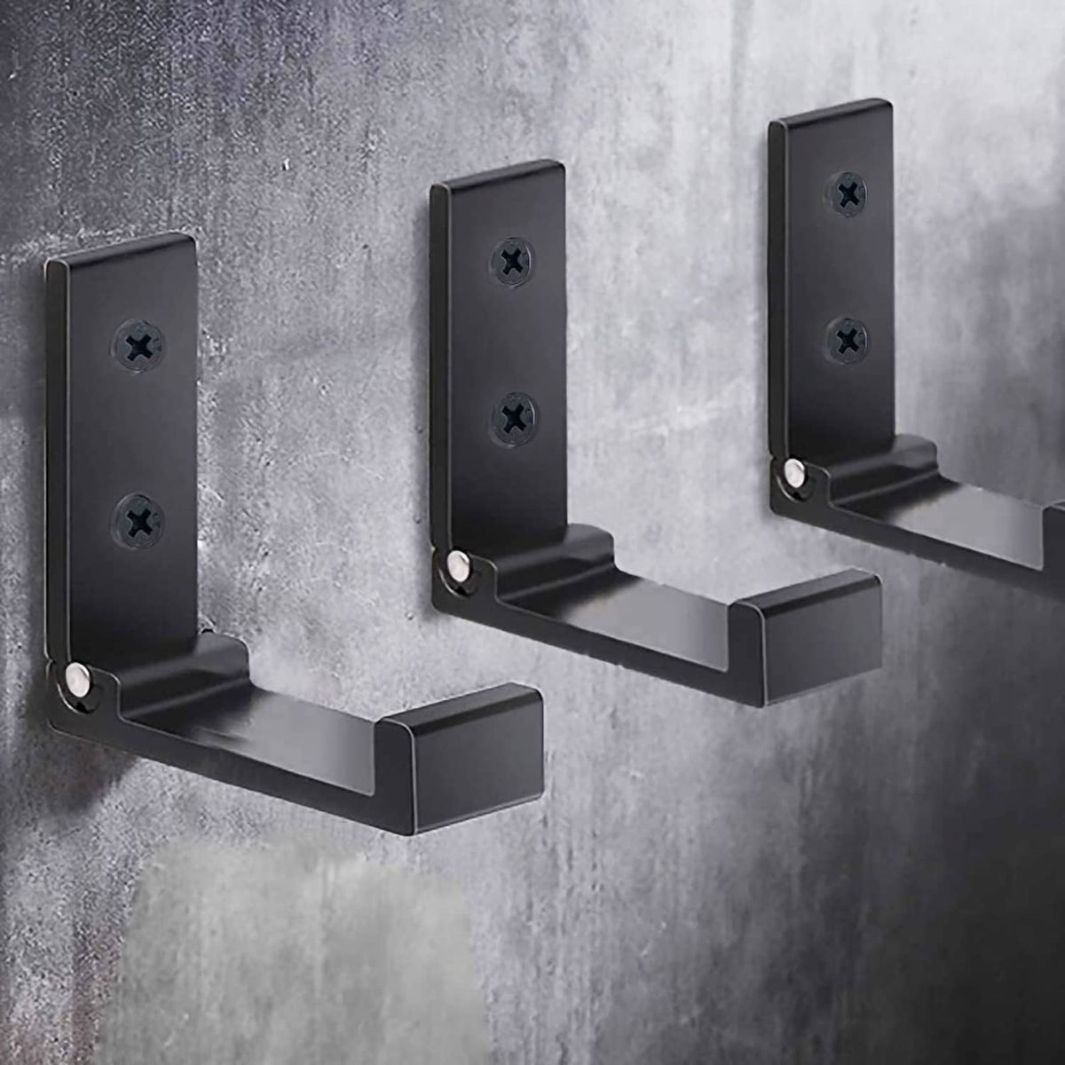 Three black folding wall hooks with U-shaped arms for hanging items