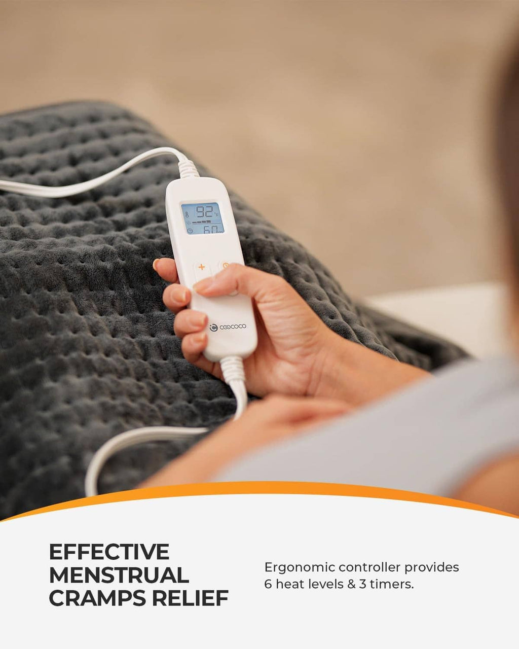 Gray heating pad with controller displaying temperature level.