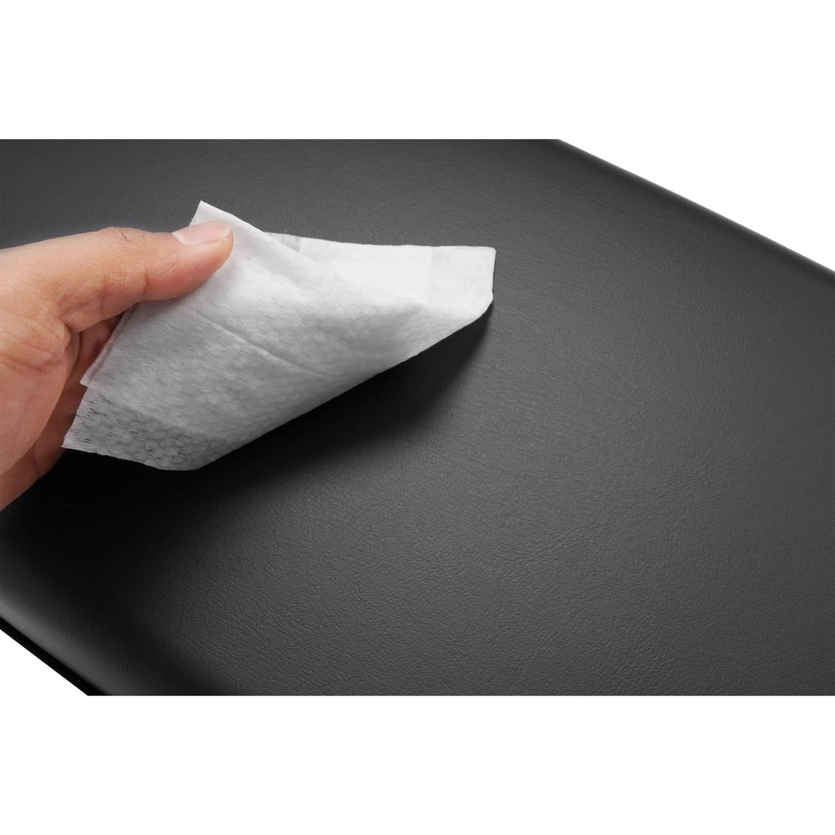 Black cushion surface with protective film being peeled off