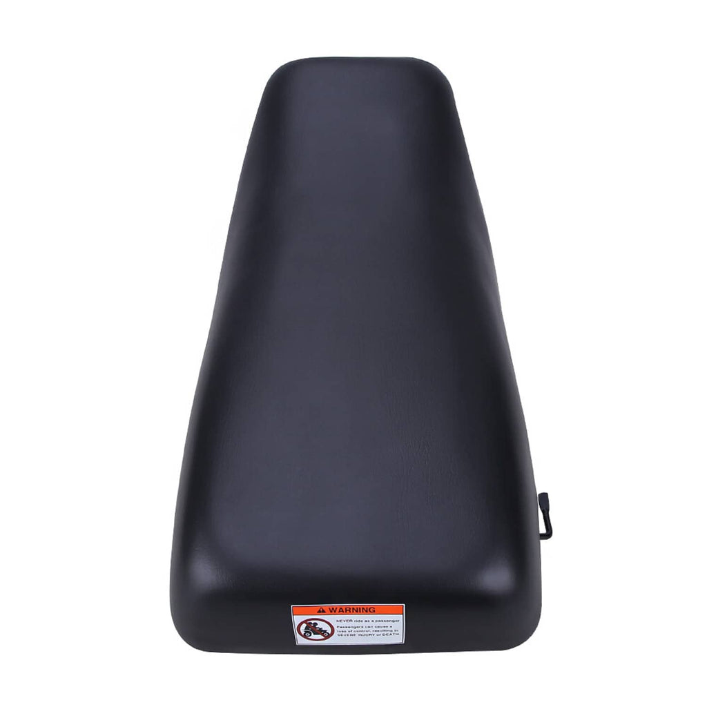 Black ATV seat with warning label and rear mounting clip, studio close-up