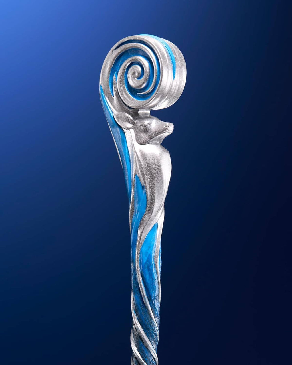 Tall wand figure with silver body and blue spiral orb at the top